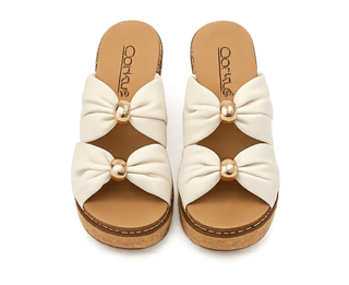 Corky's miss understood ivory wedges.