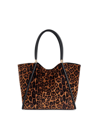 A leopard print tote bag with black leather handles and trim.