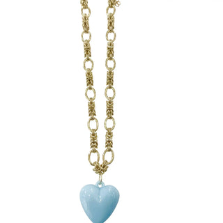 Gold chain necklace with a blue heart pendant.