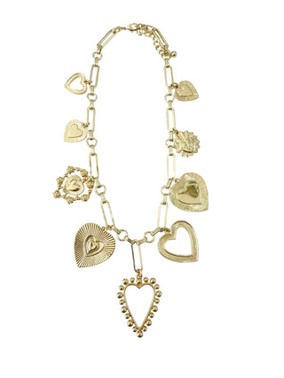 Gold charm necklace with various heart-shaped pendants 
