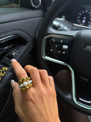 An 18k gold plated ring with pearls