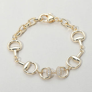 Gold bracelet with horse bit links.