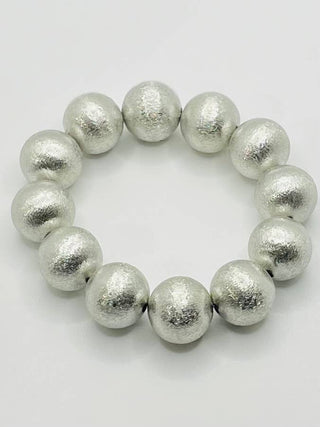 Brushed silver beaded stretch bracelet.