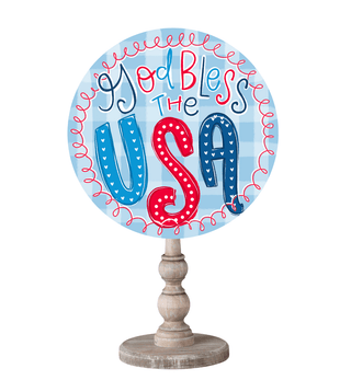 Decorative topper with 'God Bless the USA' text.