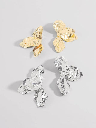 Hammered flower shaped statement earrings.