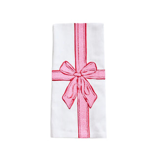 White holiday tea towel with pink bow design.
