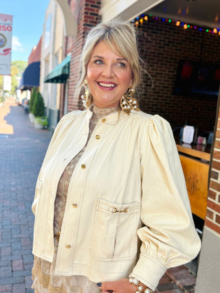 ivory/ cream denim jacket.  metal hardware and puffy sleeves
