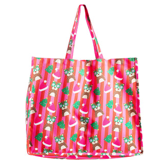 A pink striped tote bag with a festive pattern of Santa hats, leopards and Christmas trees.