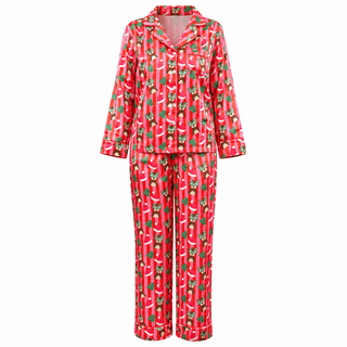 A two-piece pajama set featuring a red and pink striped long-sleeve top and matching pants with an all-over festive green and white pattern of Santa hats, leopards and christmas trees.