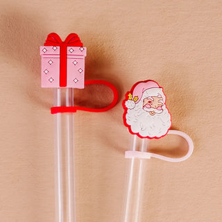 Two Christmas-themed straw toppers 