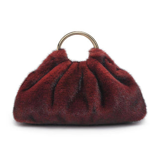 Red fur handbag with a gold ring handle 