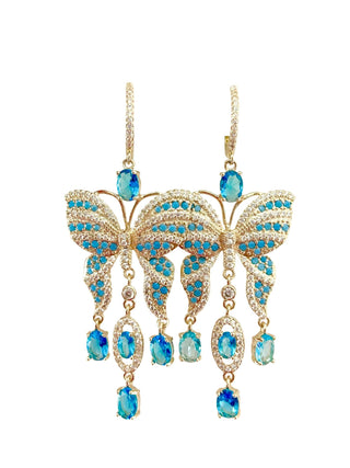 Butterfly-shaped earrings with blue gemstones.