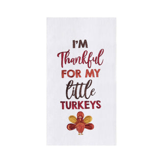 A white kitchen towel featuring the text 'I'M Thankful FOR MY little TURKEYS' in red and brown lettering, with a small embroidered-style turkey at the bottom.