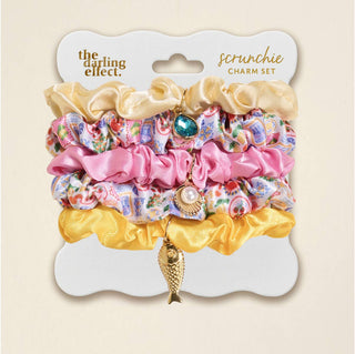 Set of colorful scrunchies with charms by the darling effect.