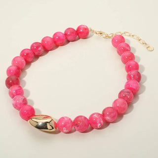 Pink marble beaded bracelet with gold clasp.