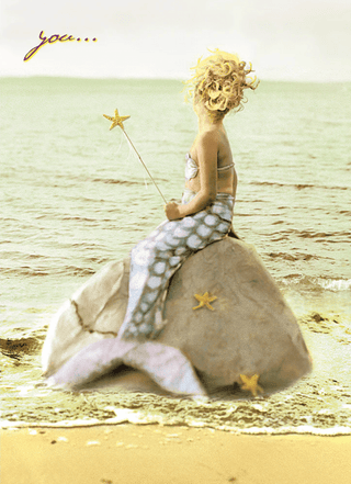 Mermaid sitting on a rock by the ocean with a starfish wand birthday card.