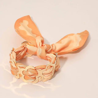 Orange and gold adjustable scarf bracelet.