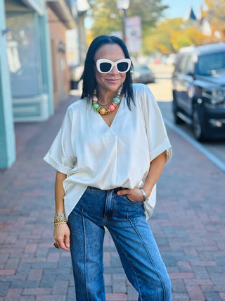 cream colored silk blouse