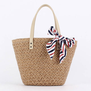 Woven straw bag with a striped scarf.