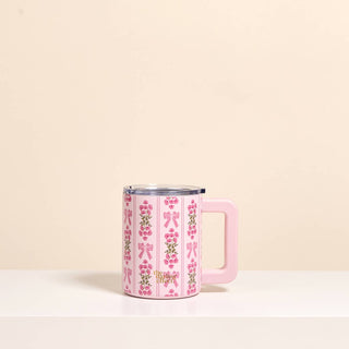 Pink insulated 140z mug with bow pattern.