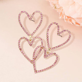 Heart-shaped earrings with pink gemstones 