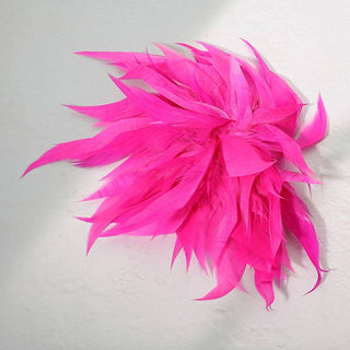 A bright hot pink feather hair clip accessory could be used as a pin or brooch as well.