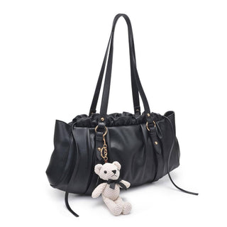 Black handbag with a bear charm