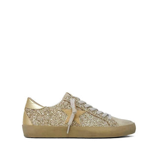Gold glitter sneakers.