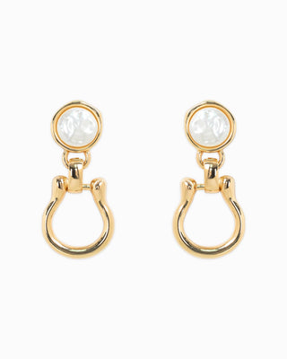 Gold horsebit earrings with pearl detail.