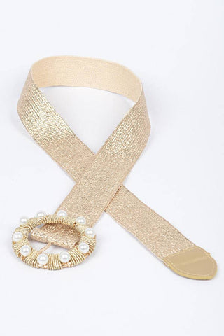 Gold belt with pearl embellishments.