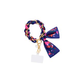 A navy floral pattern phone wristlet.