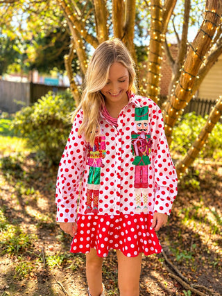 queen of sparkles red and white polka dot dress with pink and green sequined nutcrackers