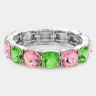 Bracelet with pink and green gemstones.