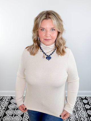 cream mock neck ribbed sweater