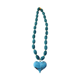 Turquoise beaded necklace with a heart-shaped pendant.
