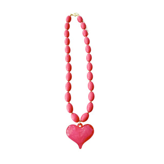 Hot pink colored heart necklace.