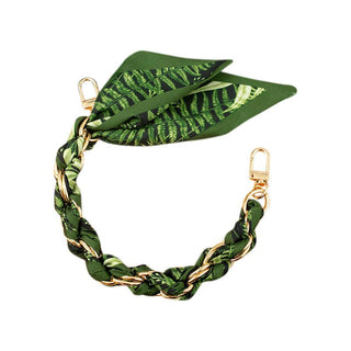 Green leaf-patterned phone strap with gold chain 
