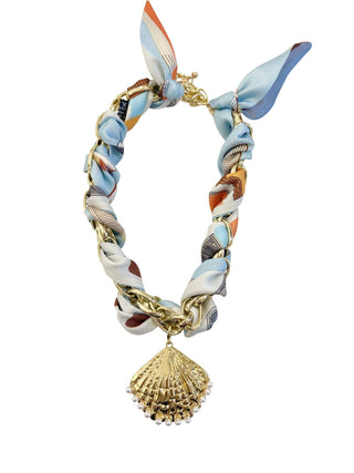 Scarf necklace with shell pendant.