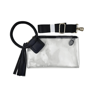 A clear plastic wristlet with a black faux leather cuff handle and a black tassel. It has a zip top closure and gold-tone hardware.