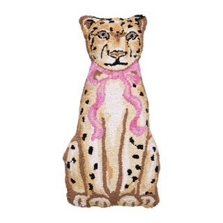 Leopard-shaped wool hook pillow with a pink ribbon.