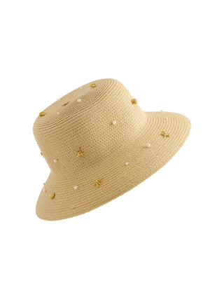 Beige straw hat with pearl embellishments and gold nautical charms.