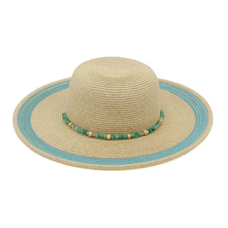 Beige straw hat with a blue band and decorative beads.