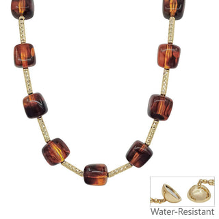 A water-resistant amber glass bead necklace with gold-toned chain links and magnetic clasp.