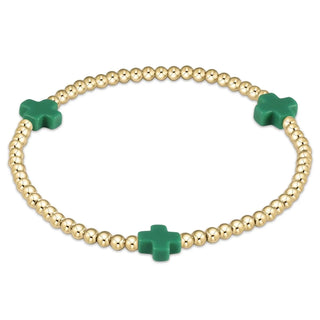 Signature 3mm gold beaded bracelet with green cross charms.