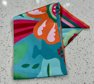 Silky scarf with floral and striped pattern.