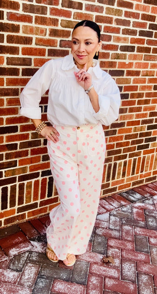Pink and white polka dot pants.