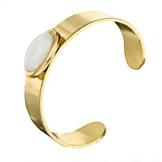 A high-polish gold-tone open cuff bracelet with a centered oval white agate stone.