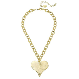 Gold heart-shaped pendant necklace by Susan Shaw.