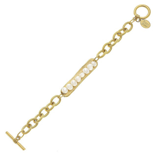Gold bracelet with pearl accents by Susan Shaw.