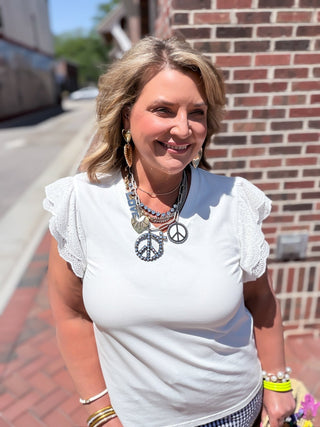 white ruffle eyelet sleeve top